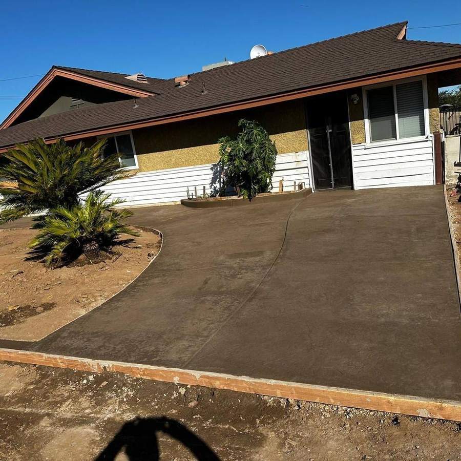 New concrete driveway and approach on a ranch-style home