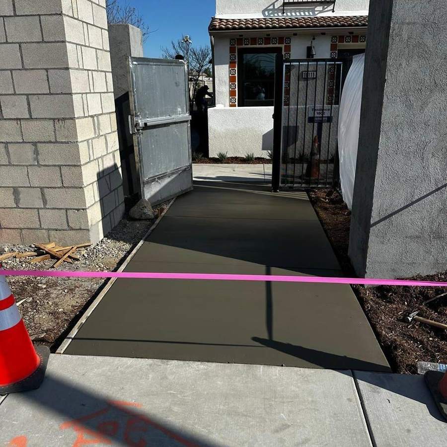 Concrete entry with block wall