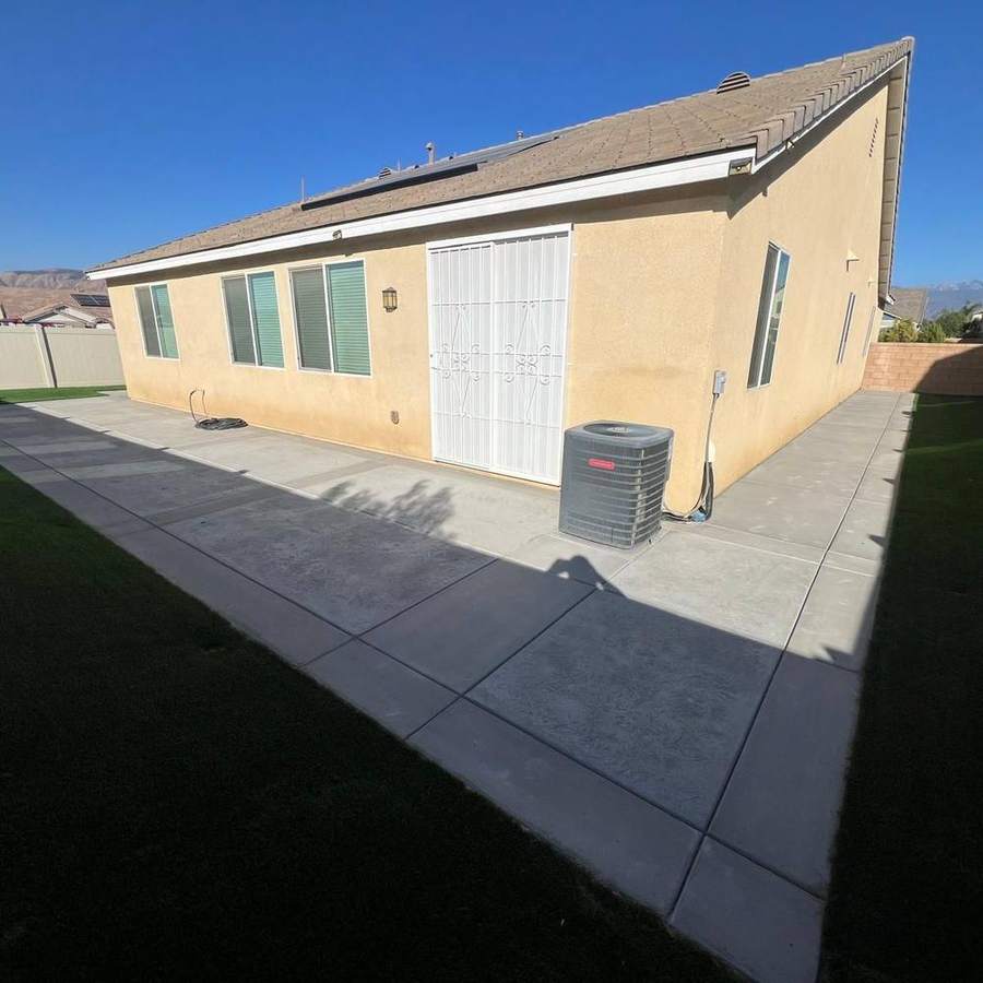 Concrete walkway with a turf strip